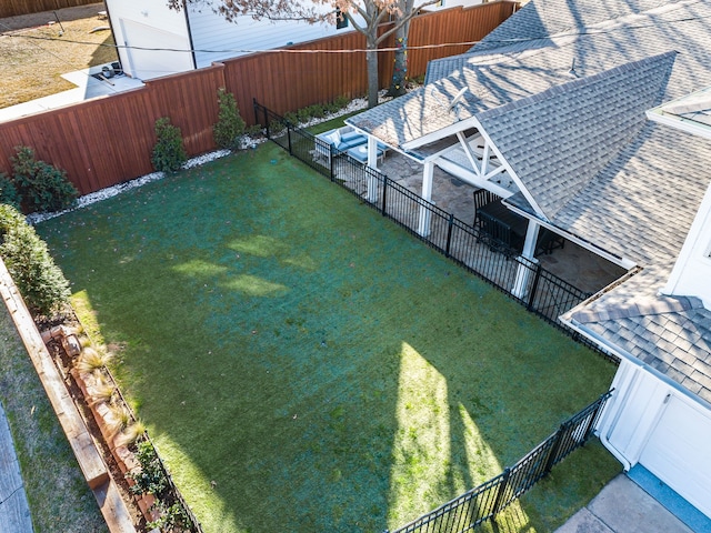 view of yard with a fenced backyard