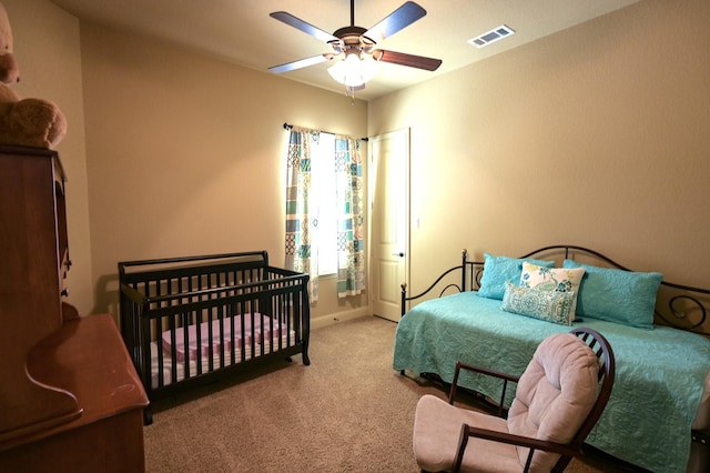 bedroom with visible vents, baseboards, a ceiling fan, and carpet floors