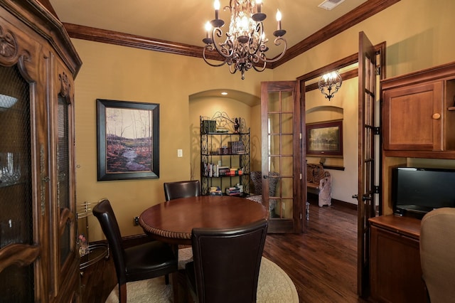 dining area featuring a chandelier, arched walkways, crown molding, and dark wood-style flooring