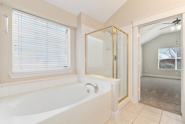 bathroom featuring lofted ceiling, ceiling fan, tile patterned flooring, a shower stall, and a bath