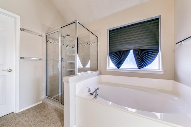 full bathroom featuring a shower stall, a healthy amount of sunlight, and a garden tub