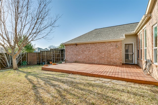 view of yard with a deck and fence