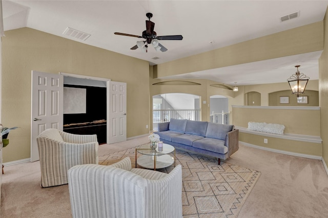 living area with light carpet, visible vents, and baseboards