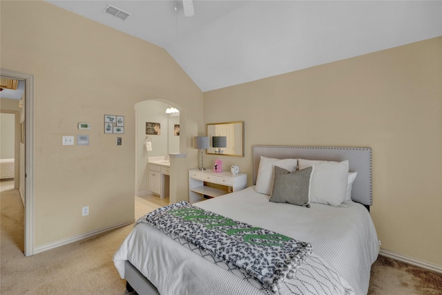 bedroom with arched walkways, visible vents, light carpet, and vaulted ceiling