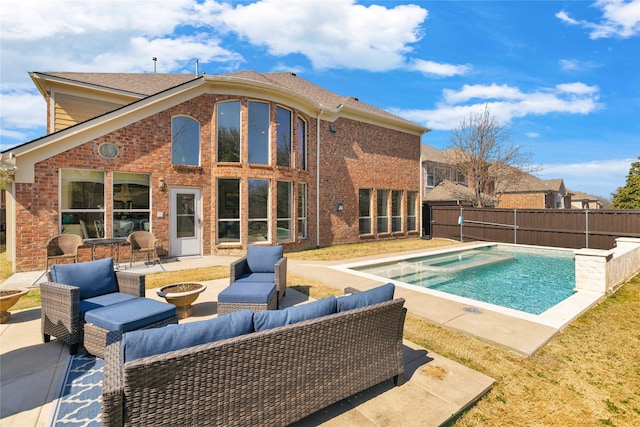 view of swimming pool with an outdoor living space with a fire pit, a patio area, a fenced in pool, and a fenced backyard