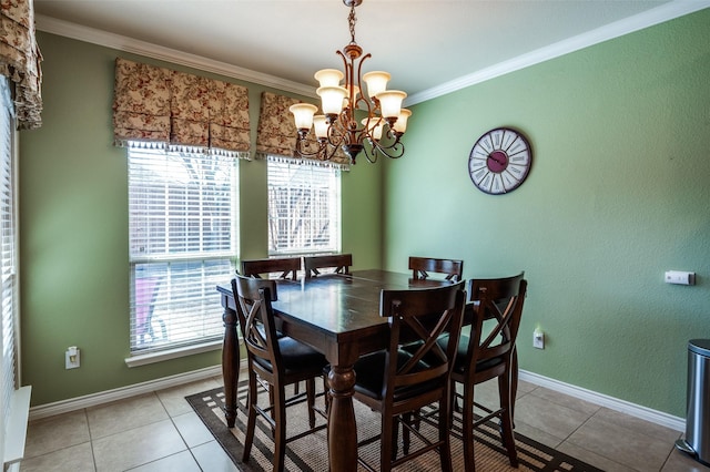 dining room with an inviting chandelier, light tile patterned floors, baseboards, and ornamental molding