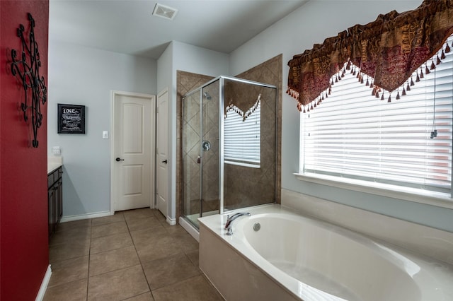 full bath with visible vents, a garden tub, a stall shower, tile patterned flooring, and vanity