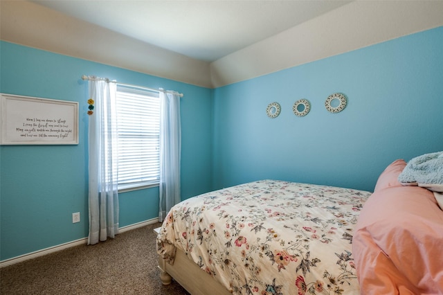 bedroom featuring baseboards and carpet floors