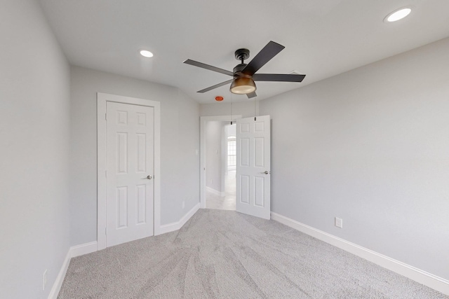 unfurnished bedroom featuring recessed lighting, baseboards, and carpet floors