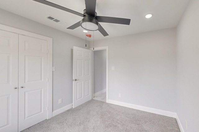 unfurnished bedroom featuring visible vents, baseboards, and carpet flooring