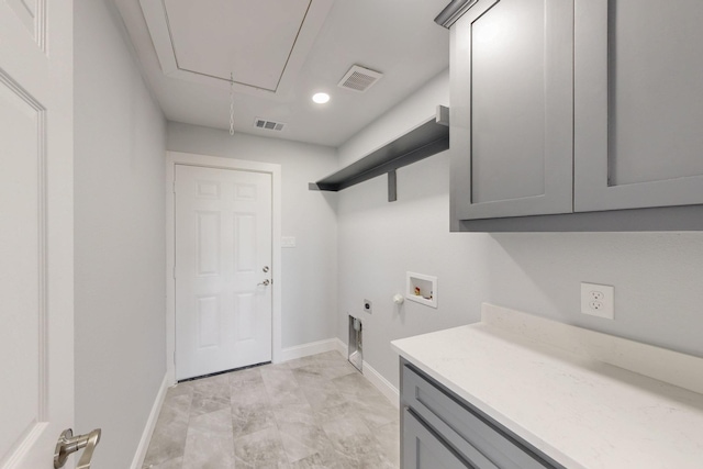 laundry area featuring visible vents, attic access, hookup for a washing machine, cabinet space, and hookup for an electric dryer