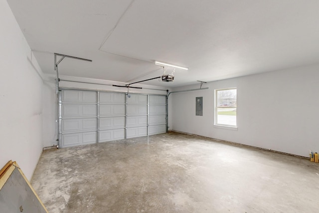 garage with electric panel and a garage door opener