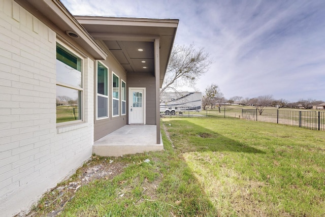 view of yard featuring a patio area and fence