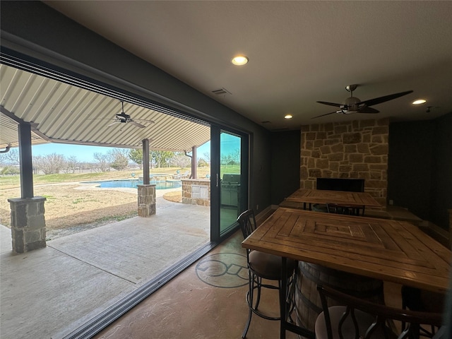 view of patio / terrace with an outdoor pool, visible vents, and a ceiling fan