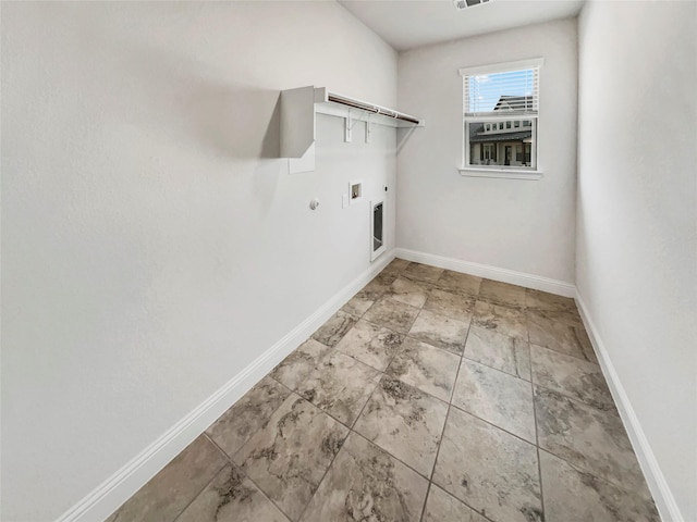 washroom with baseboards, washer hookup, laundry area, hookup for a gas dryer, and hookup for an electric dryer