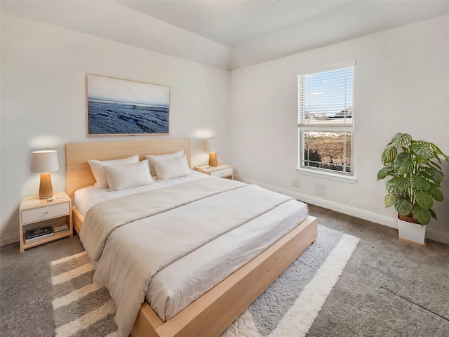 bedroom featuring baseboards and carpet floors