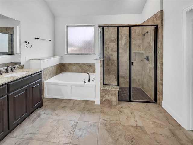 bathroom with vanity, a shower stall, and a bath