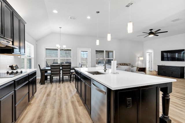 kitchen featuring dishwasher, black electric stovetop, visible vents, and a sink