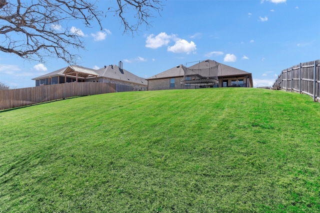 view of yard with a fenced backyard