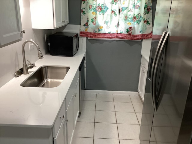 6930 Trailcrest Dr, Dallas, TX 75232 - kitchen featuring stainless steel appliances, light countertops, white cabinets, and light tile patterned floors