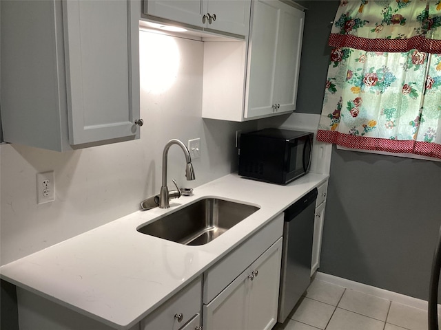 6930 Trailcrest Dr, Dallas, TX 75232 - kitchen featuring black microwave, dishwasher, light countertops, and light tile patterned flooring