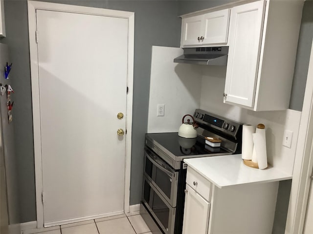 6930 Trailcrest Dr, Dallas, TX 75232 - kitchen with range with two ovens, under cabinet range hood, light countertops, and white cabinetry