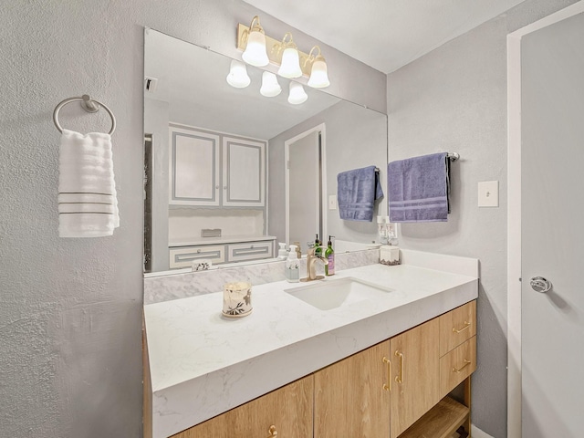 6930 Trailcrest Dr, Dallas, TX 75232 - bathroom featuring vanity and a textured wall