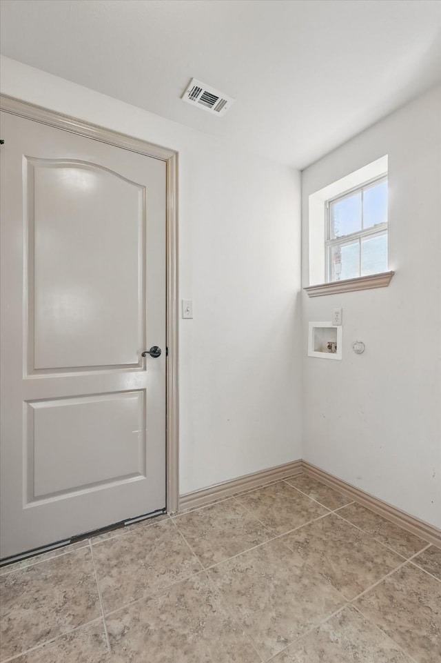 washroom with hookup for a washing machine, baseboards, visible vents, laundry area, and tile patterned floors