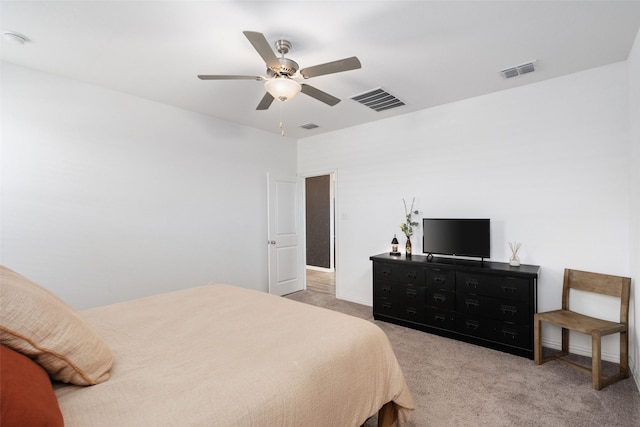 bedroom with a ceiling fan, visible vents, and light carpet