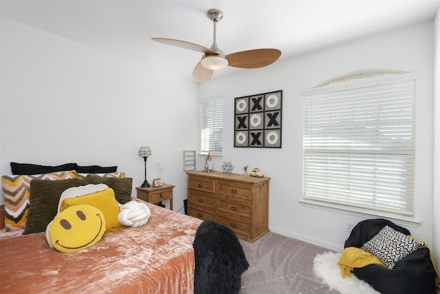 bedroom with carpet flooring, baseboards, and ceiling fan