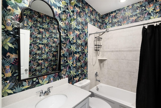 full bathroom with wallpapered walls,  shower combination, toilet, and vanity