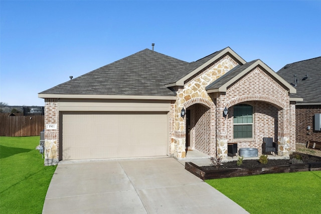 french country style house featuring a front yard, brick siding, driveway, and a shingled roof