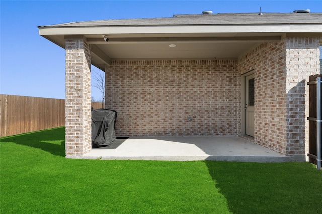 exterior space with a patio and fence