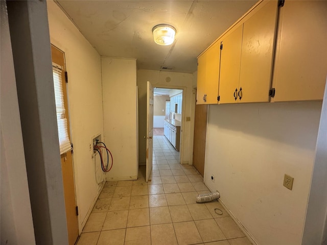 corridor with light tile patterned floors and visible vents