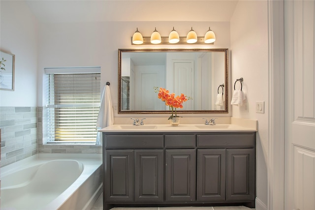 full bathroom featuring a bath, double vanity, and a sink