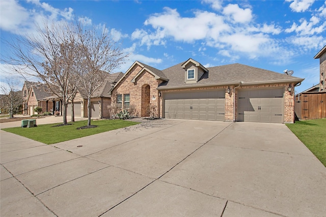 view of front facade featuring brick siding, a shingled roof, concrete driveway, a front yard, and an attached garage