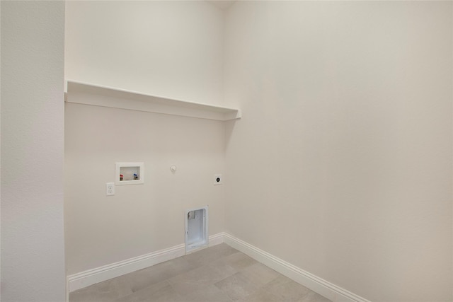 clothes washing area with hookup for a washing machine, baseboards, hookup for an electric dryer, gas dryer hookup, and laundry area