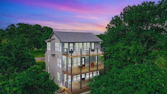 rear view of property with metal roof