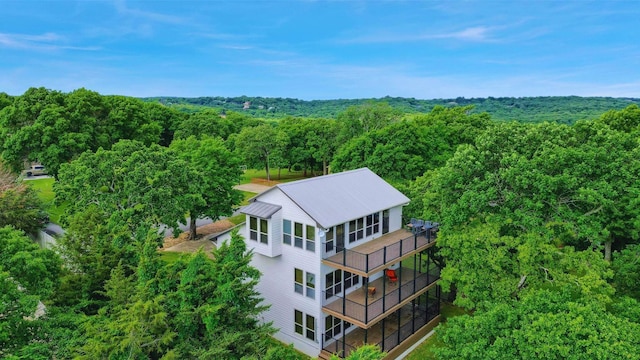 aerial view featuring a view of trees