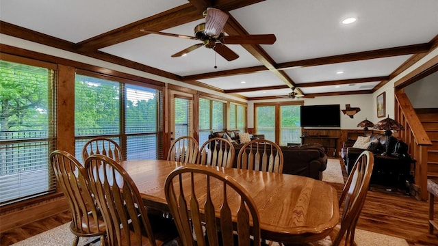 dining space with a ceiling fan, beamed ceiling, wood finished floors, and coffered ceiling