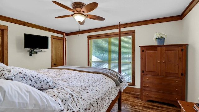 bedroom featuring a ceiling fan, dark wood-type flooring, and crown molding