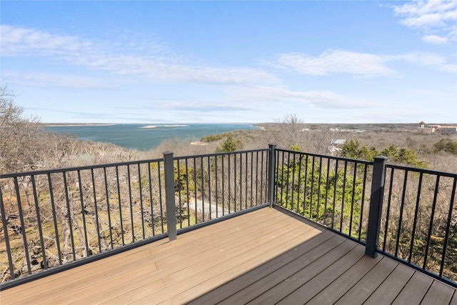 wooden deck featuring a water view