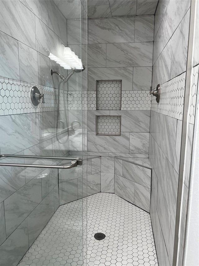 full bath with a shower stall