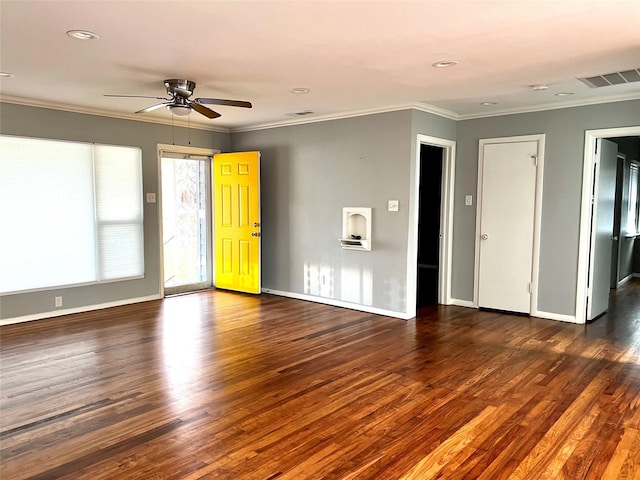 unfurnished living room featuring wood finished floors, baseboards, and ornamental molding