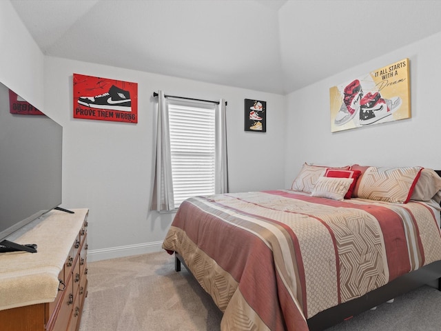 bedroom featuring light carpet, baseboards, and vaulted ceiling