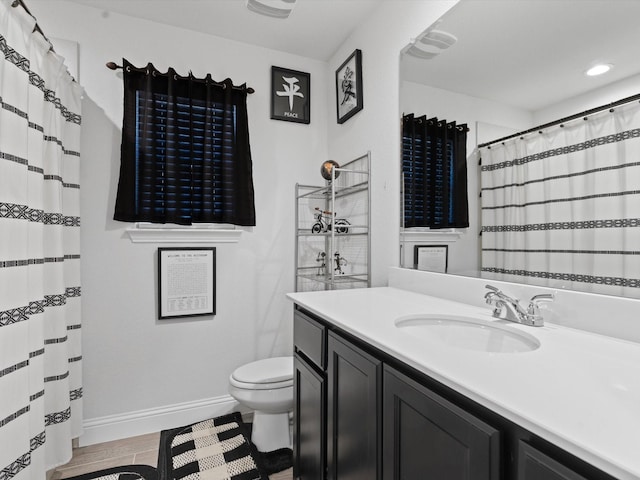 full bath with baseboards, toilet, recessed lighting, wood finished floors, and vanity