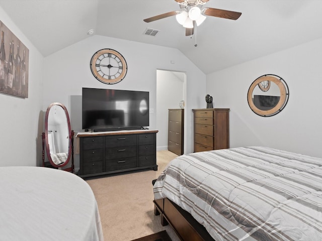 bedroom with visible vents, lofted ceiling, light colored carpet, and ceiling fan