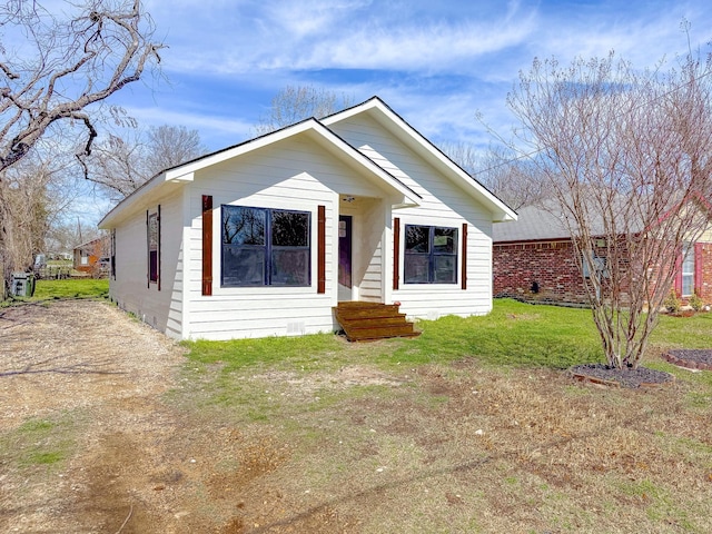 bungalow-style house featuring a front yard