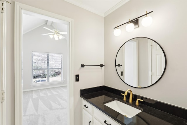 bathroom featuring vaulted ceiling with beams, ceiling fan, baseboards, ornamental molding, and vanity