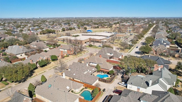 birds eye view of property with a residential view